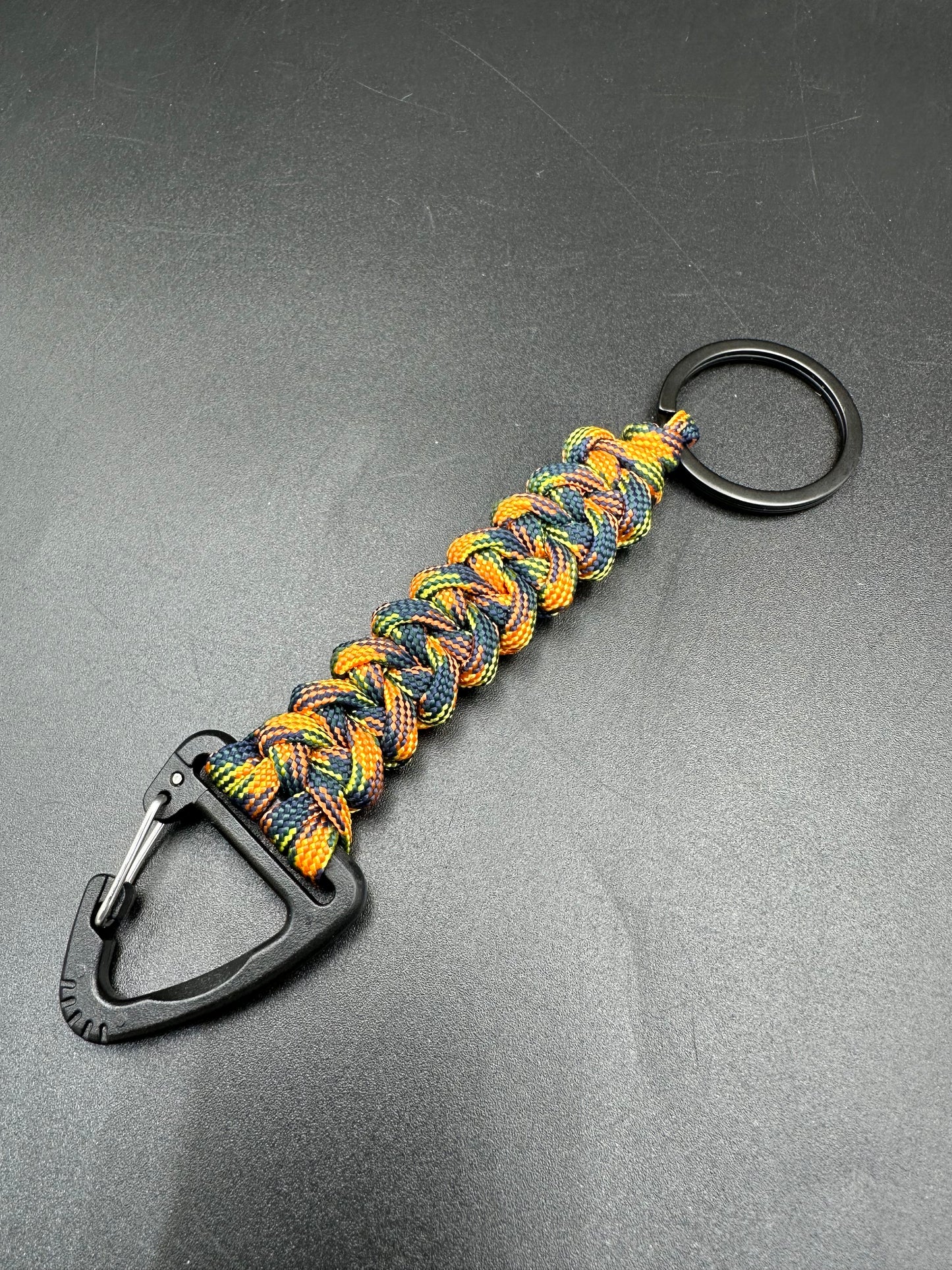 Tactical EDC Paracord keyring with triangle clip and key ring in orange jungle camouflage coloured shark jaw weave