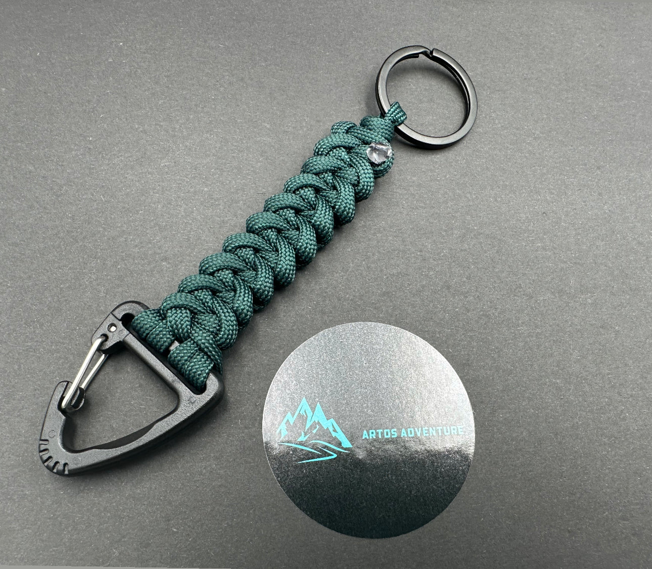 Tactical EDC Paracord keyring with a triangle clip and split ring, made in Emerald green coloured shark jaw weave
