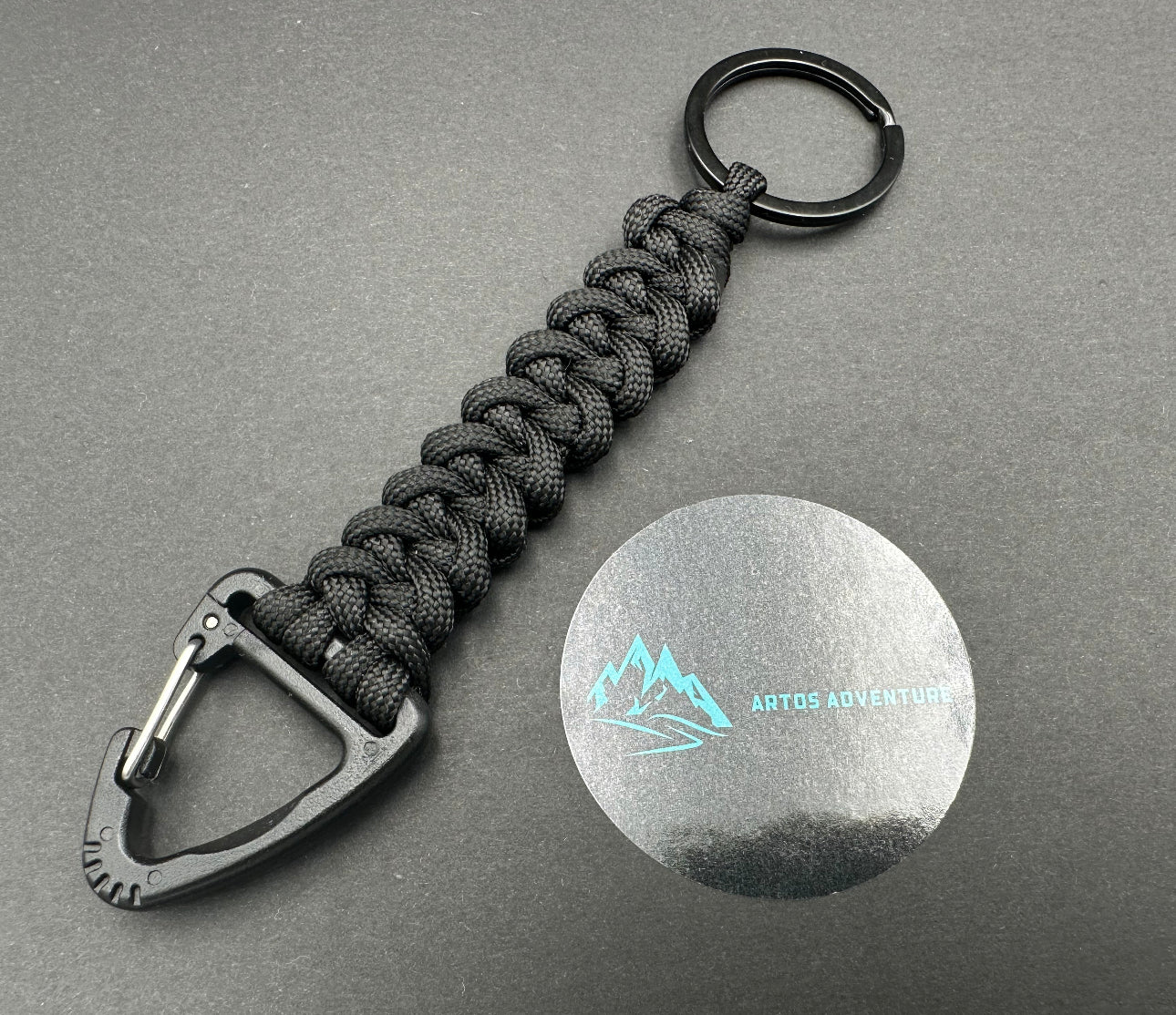 Tactical EDC Paracord keyring with a triangle clip and split ring, made in bold Black coloured shark jaw weave