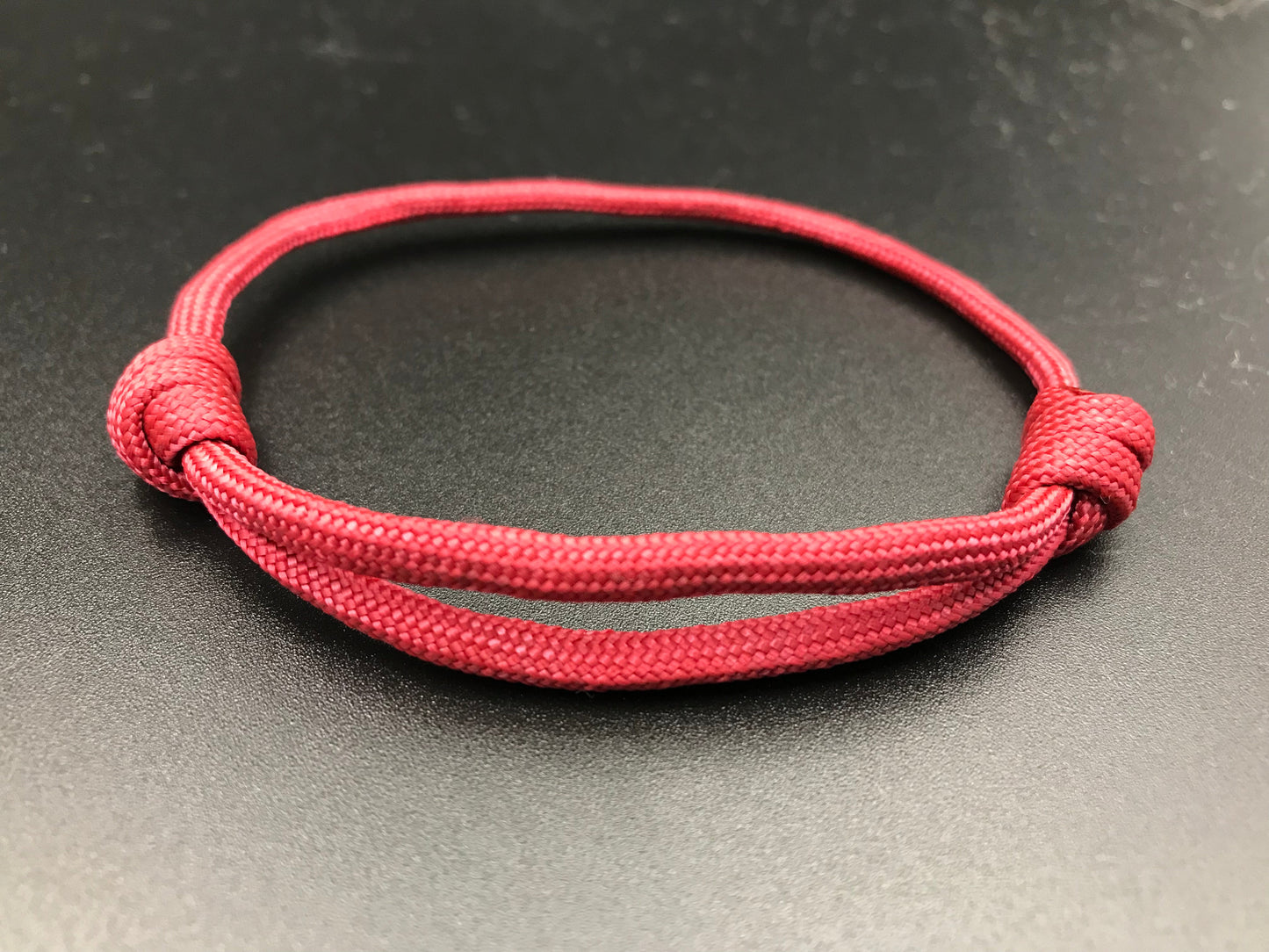 Paracord friendship bracelet In burgandy wine light weight and adjustable