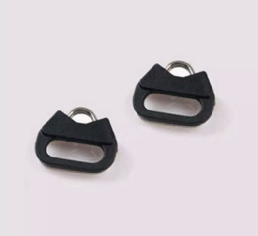 Two metal and plastic triangular shaped camera strap adaptors