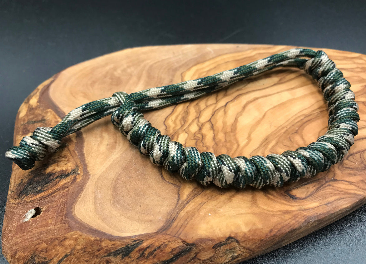 Paracord Bracelet in a dark sand camo snake knott design made in the U.K to be lightweight strong and compfortable