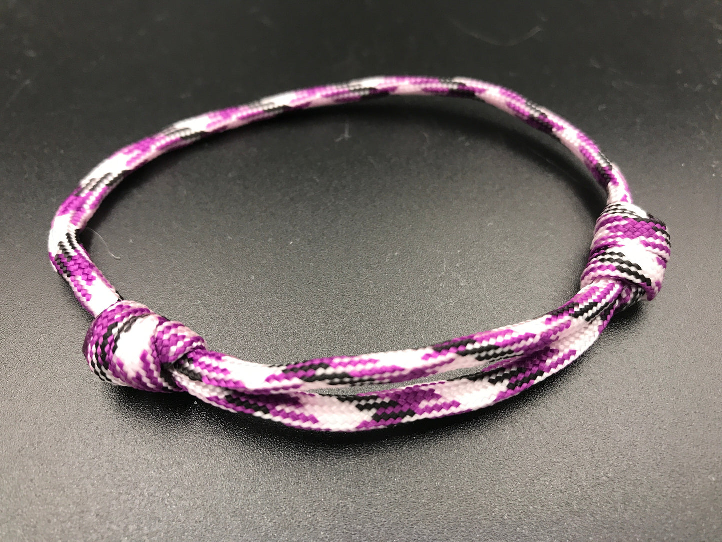Friendship bracelet in purple white and black lightweight and adjustable