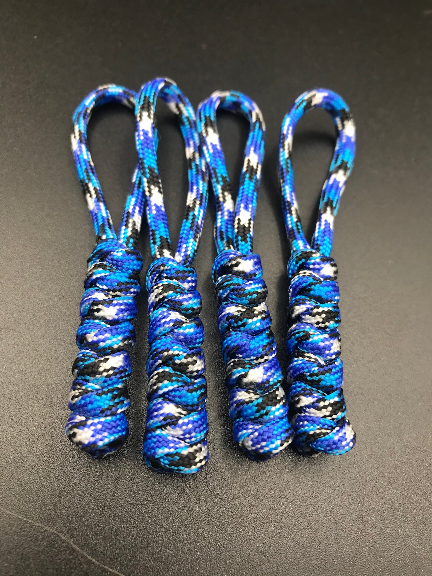 Paracord zip pulls in ocean camo ( white blue light blue and black mix) ( 4 pack) light weight and strong and handmade in U.K.