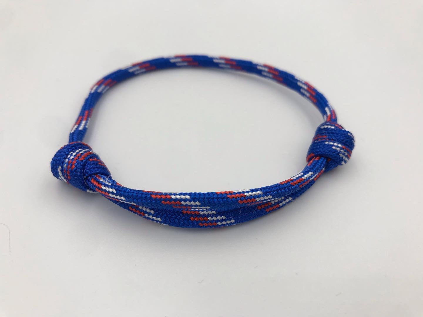 Paracord friendship bracelet in Royal blue white and red (jubilee edition)