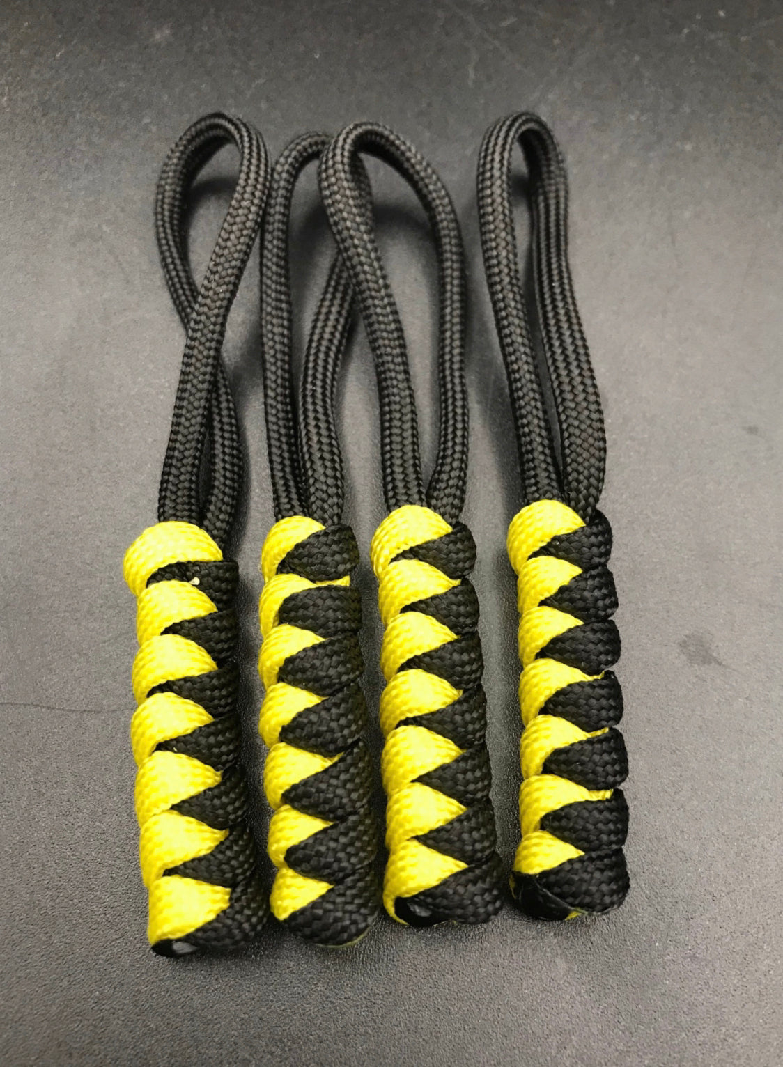 Paracord zip pulls in black and yellow (4 pack) light weight and strong, handmade in U.K