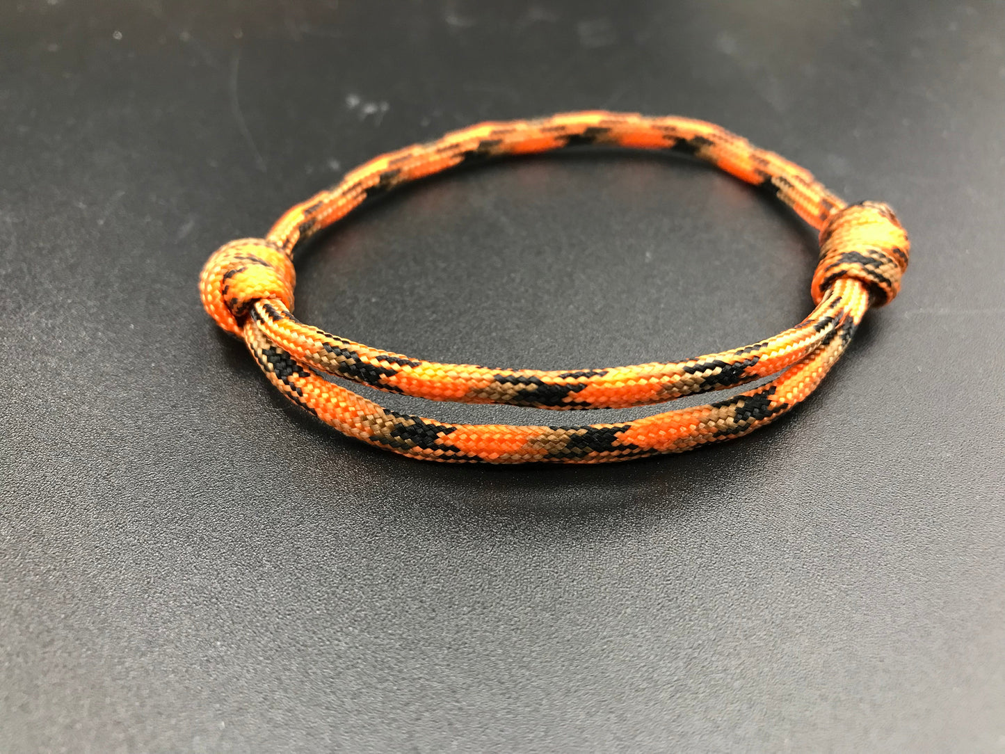 Paracord Friendship bracelet in pumpkin orange colour lightweight bracelet design