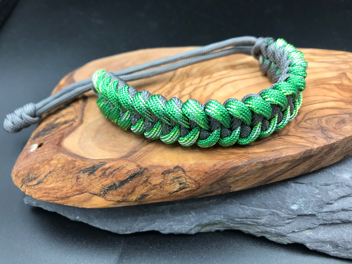 Paracord survival bracelet hand made lightweight and in green and grey courted Paracord in the shark jaw weave