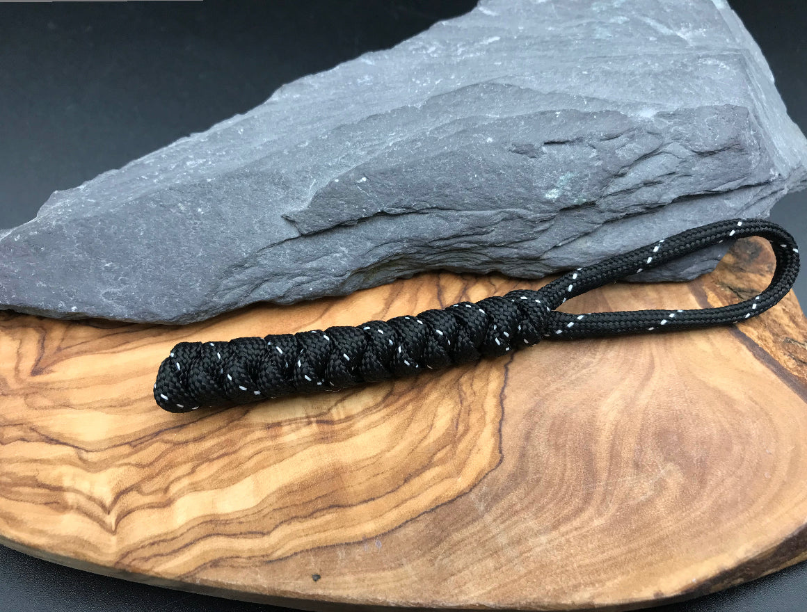 Hand made Paracord EDC multi tool - torch and keys lanyard
Made from Tactical black (black with silver) coloured Paracord in a snake knot design