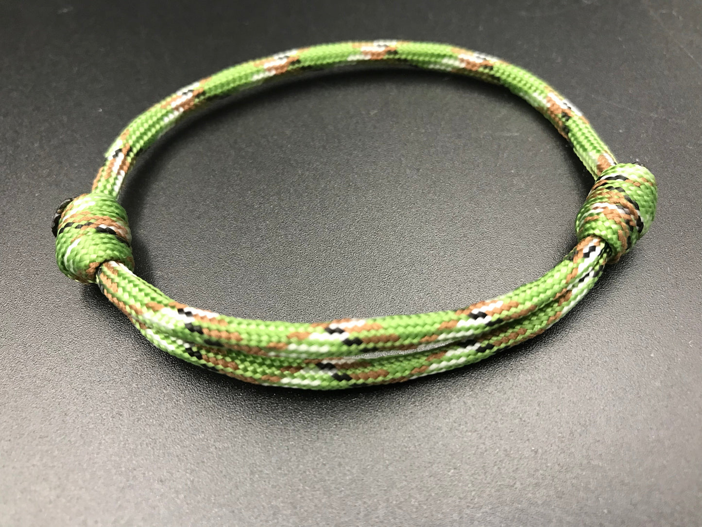 Paracord friendship bracelet In forest green camo light weight and adjustable