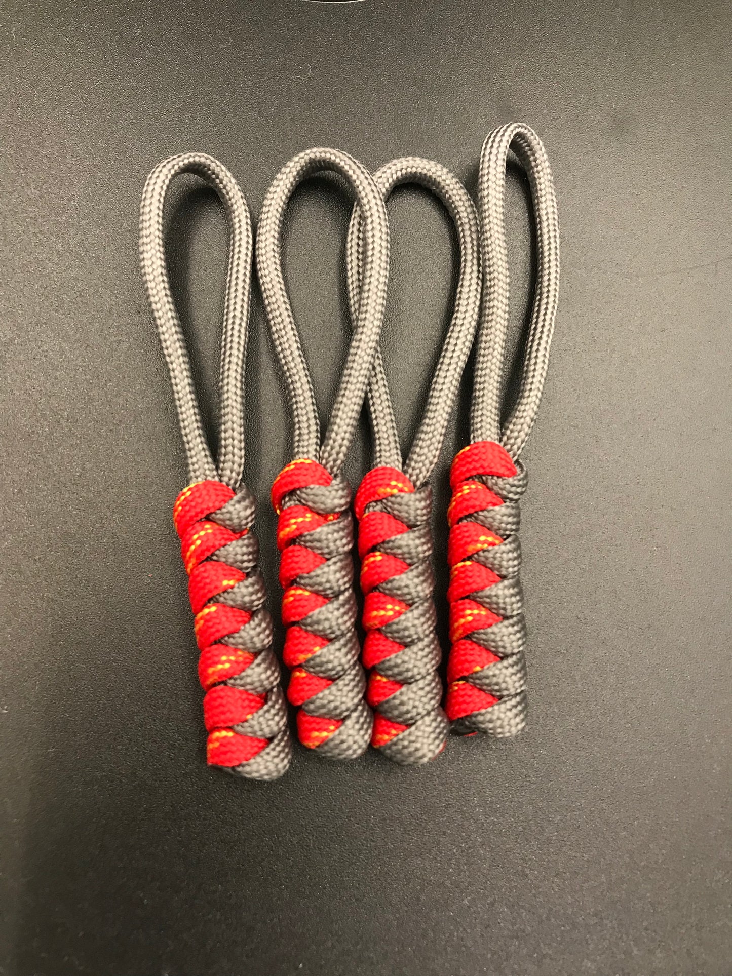Paracord zip pulls in anthracite grey and pheonix Red (light grey and red with yellow flecks) (4 pack) hand made light weight in U.K.