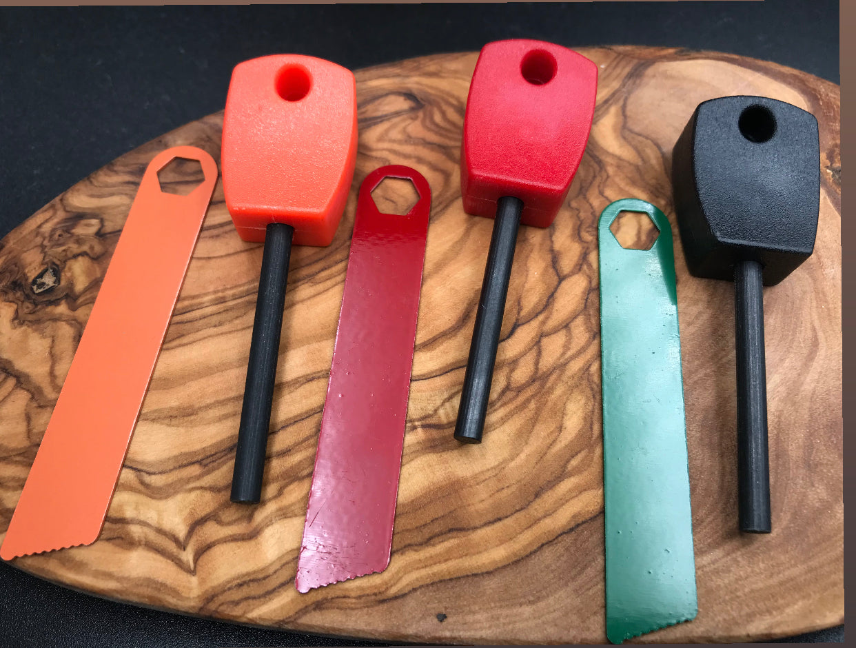 Fire steel fire starter product range in three colours orange, red , black/green
