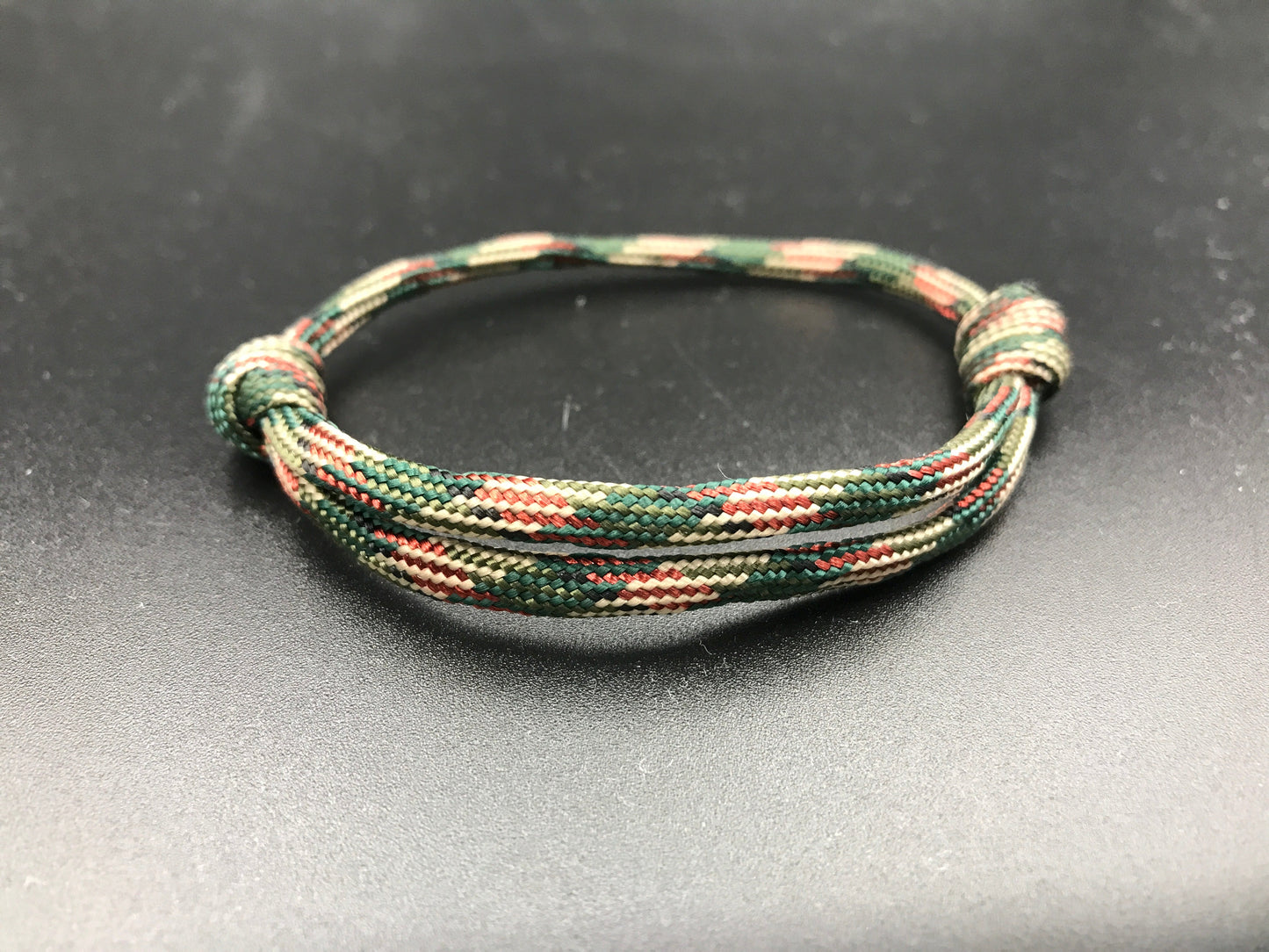 Paracord friendship bracelet in red green camo lightweight and adjustable