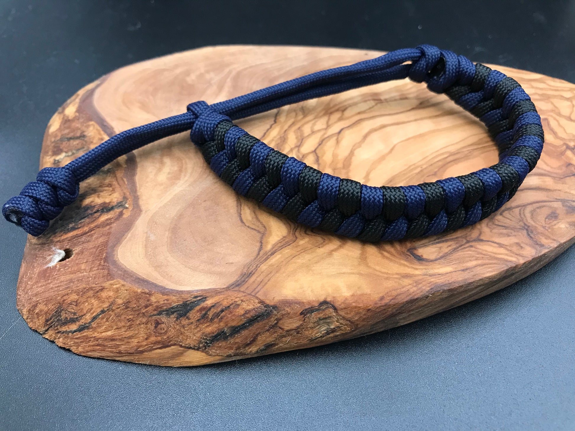 Handmade Paracord bracelet in a navy blue and black fishtail style weave