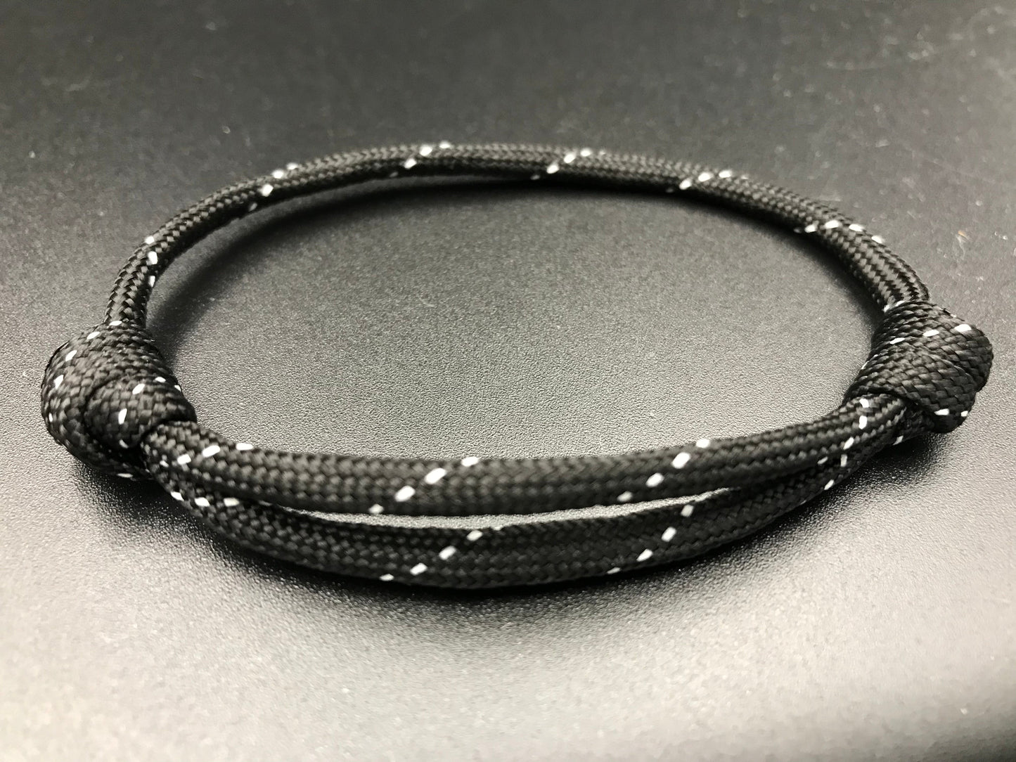 Friendship bracelet in Tactical black ( black with silver dots) lightweight and fully adjustable