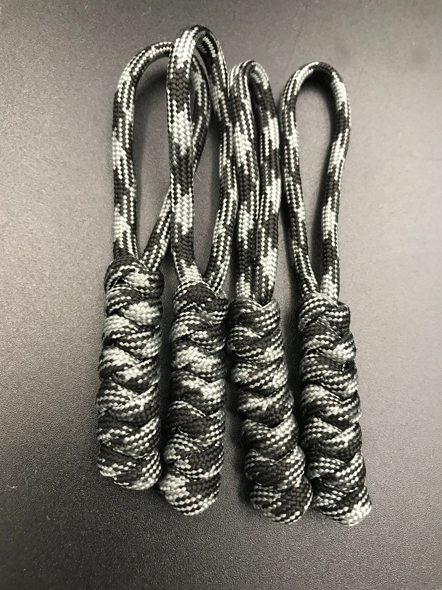 Paracord zip pulls in graphite grey (grey and black mix) ( 4 pack) light weight and strong, handmade in U.K.