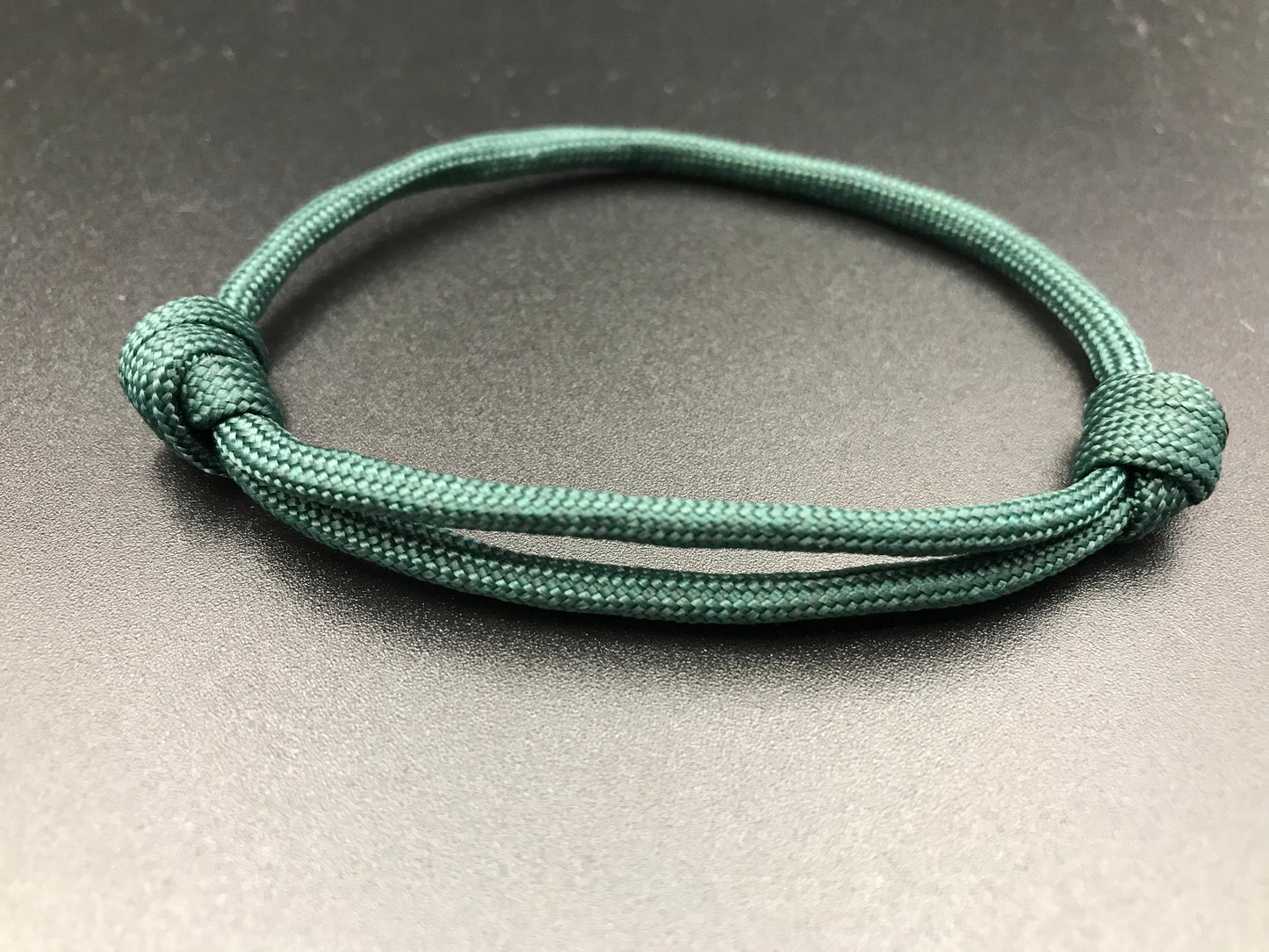 Paracord friendship bracelet in Dark emerald green light weight and fully adjustable