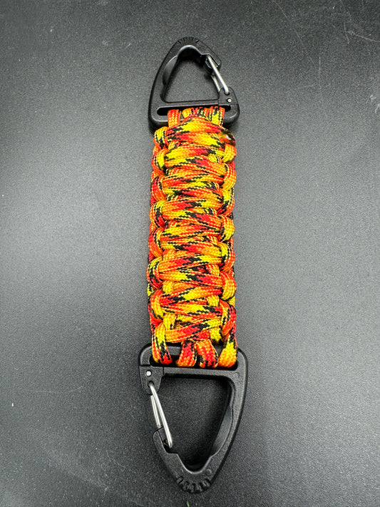 Our Tactical double ended triangle clip with a beautiful Paracord king cobra woven centre, are designed for your EDCs, molle, army bags and other field Attachments, handmade in this Fireball orange - red colour