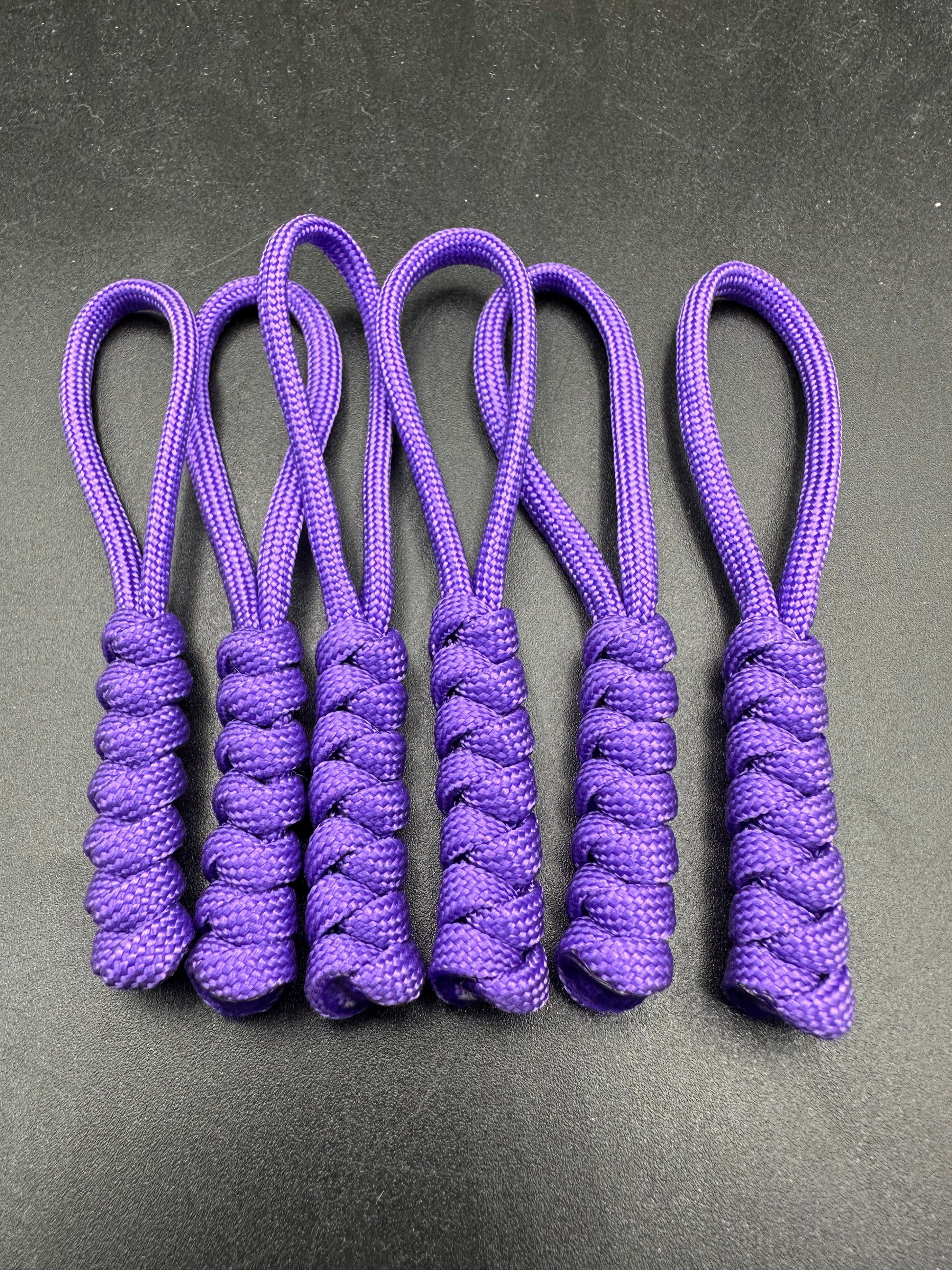 Paracord zip pulls in a Halloween themed purple
Sold as a 6 pack theses are light weight, strong and all handmade in our U.K. store