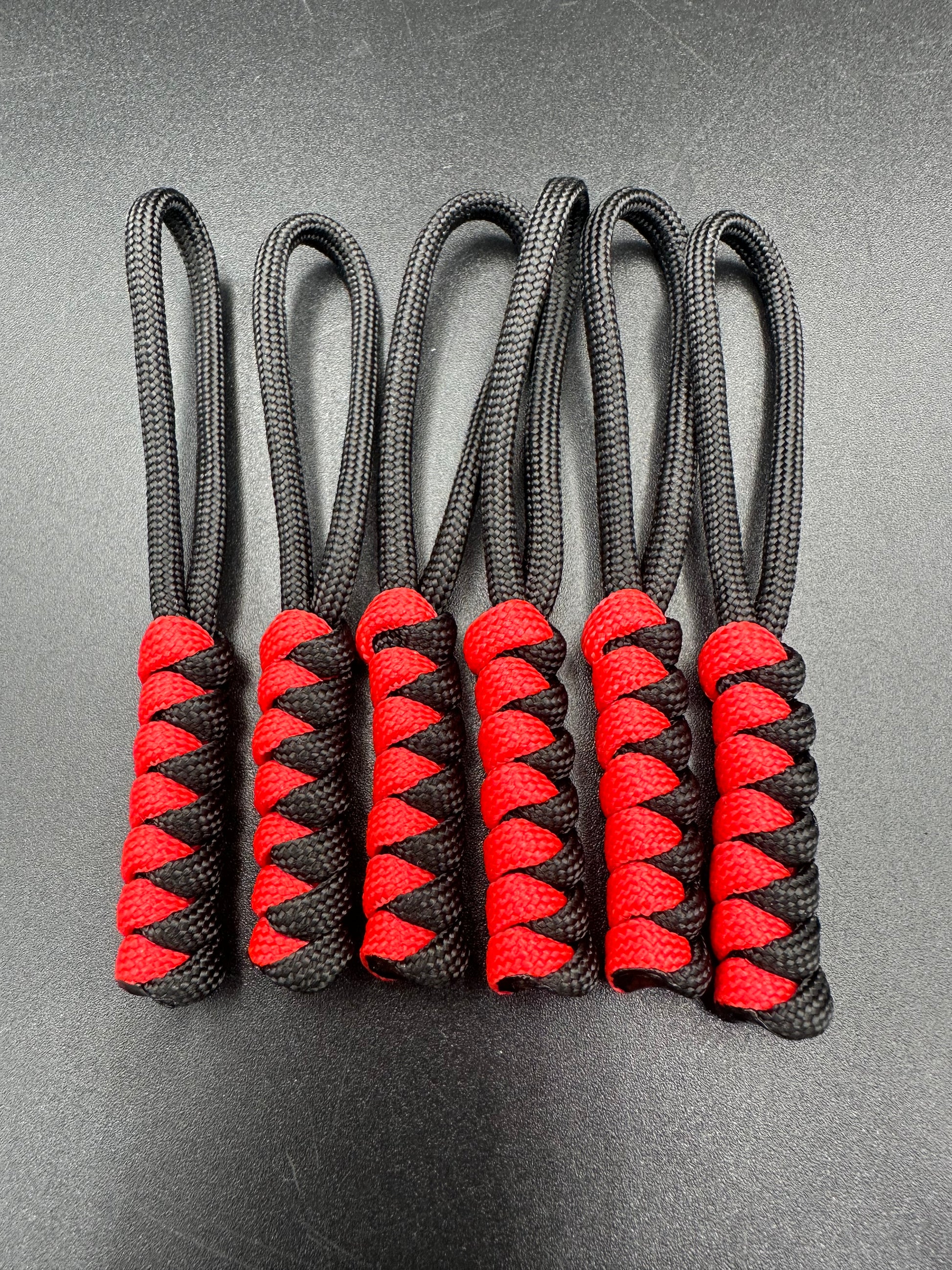 Paracord zip pulls in a Halloween themed black & red  
Sold as a 6 pack theses are light weight, strong and all handmade in our U.K. store