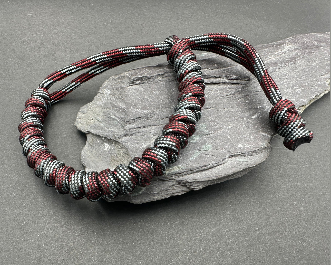 Paracord survival bracelets in burgundy and grey lightweight handmade snake knott design U.K.