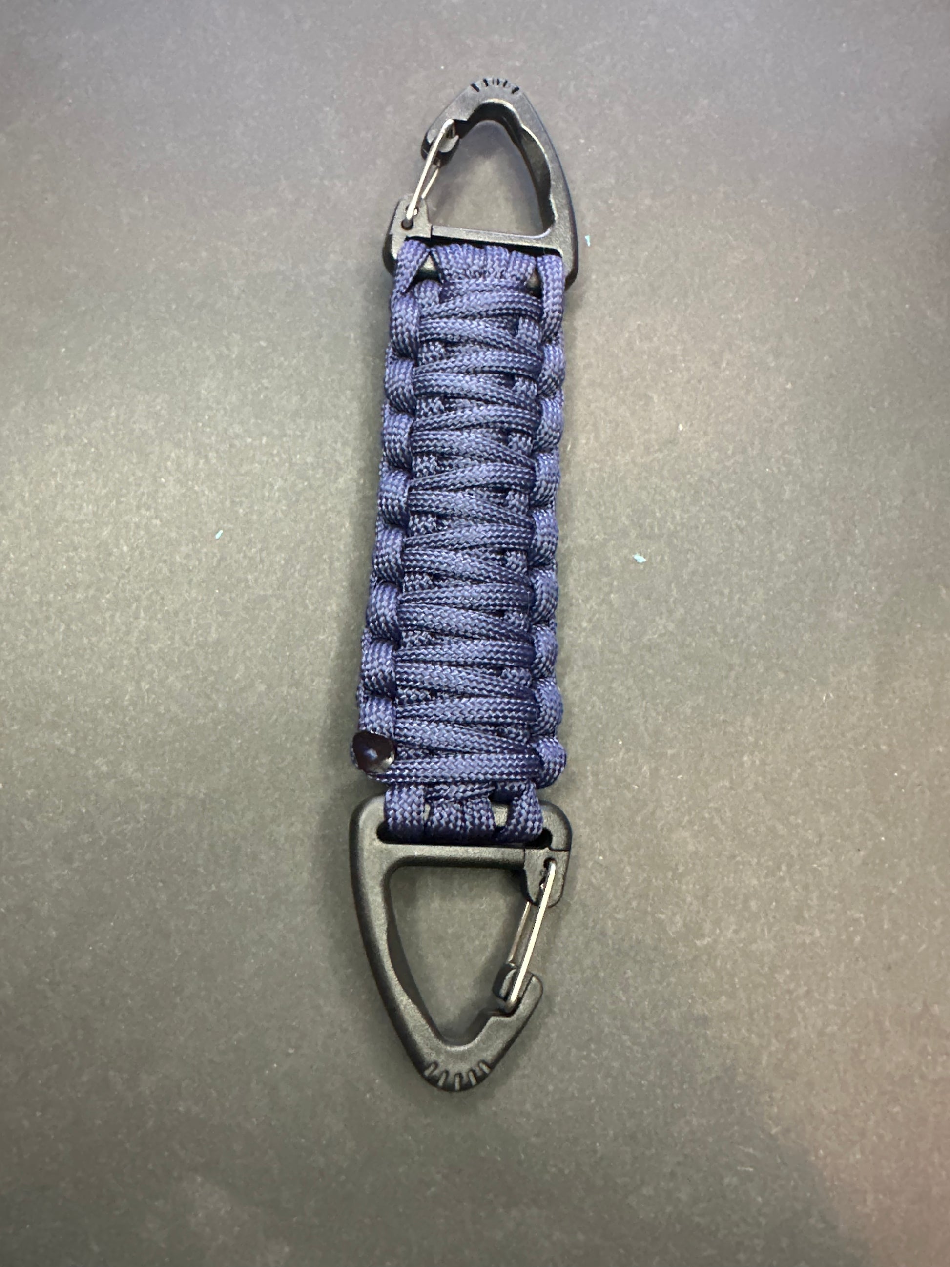 Our Tactical double ended triangle clip with a beautiful Paracord king cobra woven centre, are designed for your EDCs, molle, army bags and other field Attachments, handmade in this Navy blue colour
