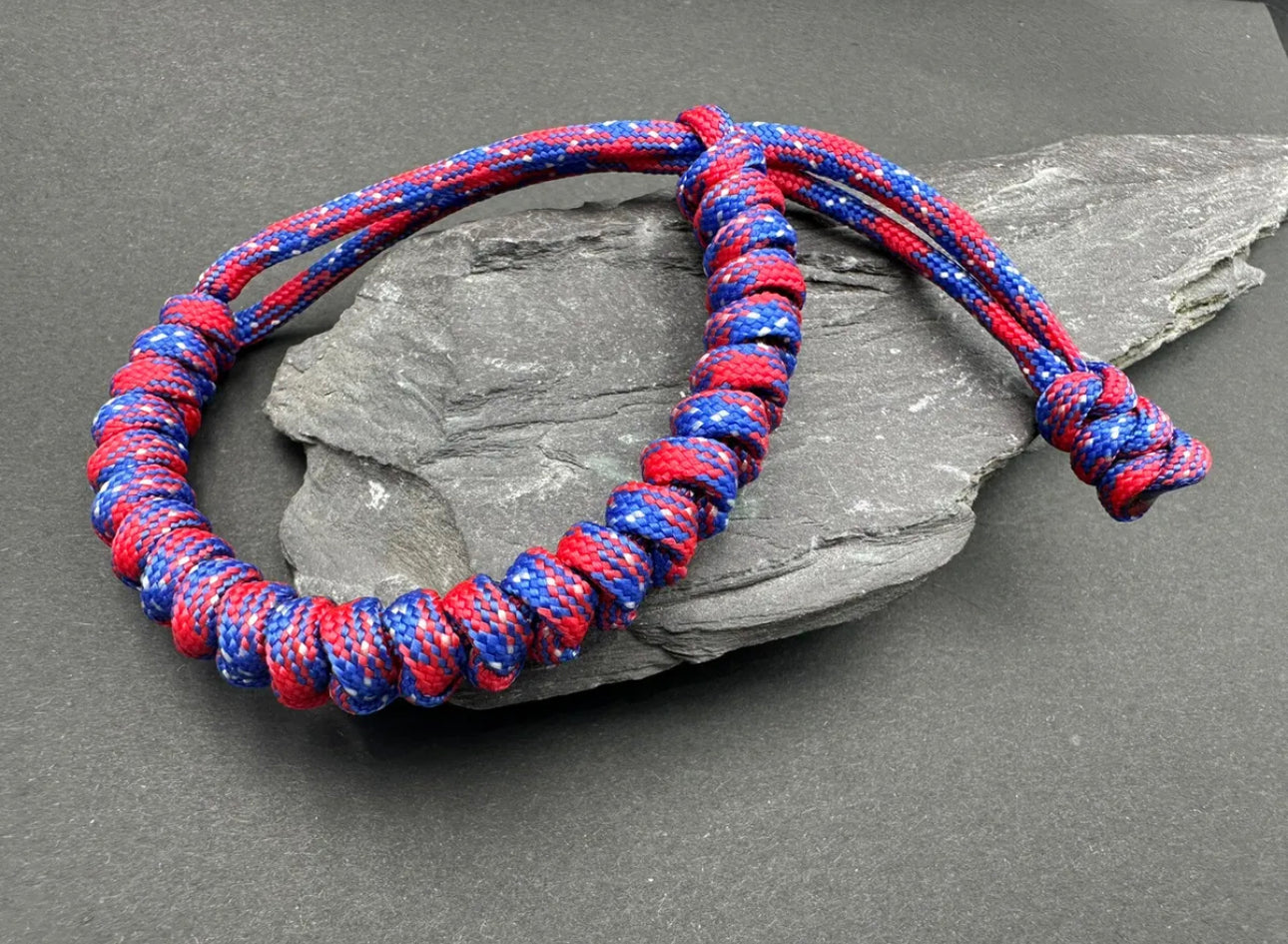 Paracord survival bracelets in Texas red flag colour (reds and blues) the item is lightweight comfortable and handmade in a snake knott tactical design U.K.