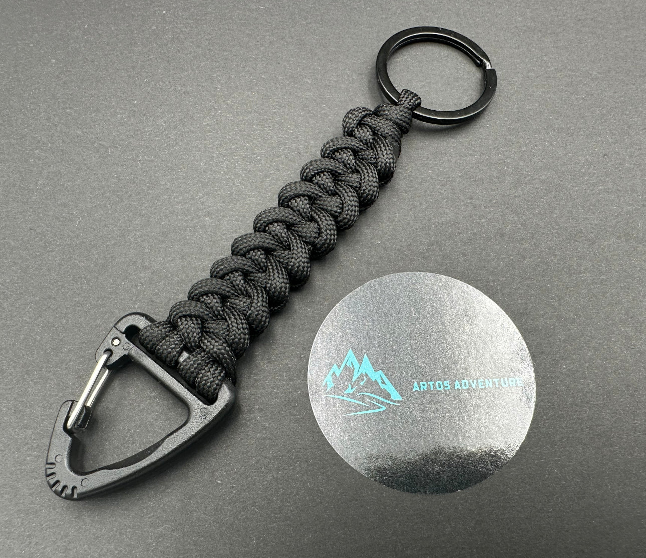 Tactical EDC Paracord keyring with a triangle clip and split ring, made in bold Black coloured shark jaw weave 
