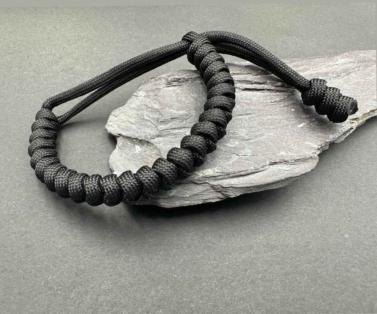 Paracord survival bracelets in Bold Black lightweight compfortable and handmade in a snake knott design U.K.