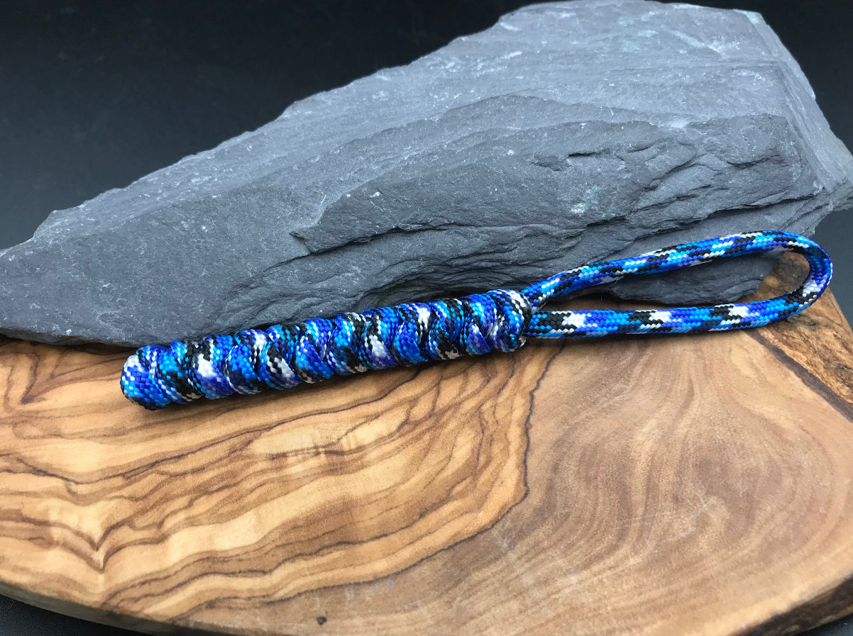 Hand made Paracord EDC multi tool - torch and keys lanyard 
Made from Ocean camo (blues whites and black) coloured Paracord in a snake knot design weave 
