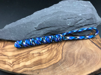 Hand made Paracord EDC multi tool - torch and keys lanyard 
Made from Ocean camo (blues whites and black) coloured Paracord in a snake knot design weave 