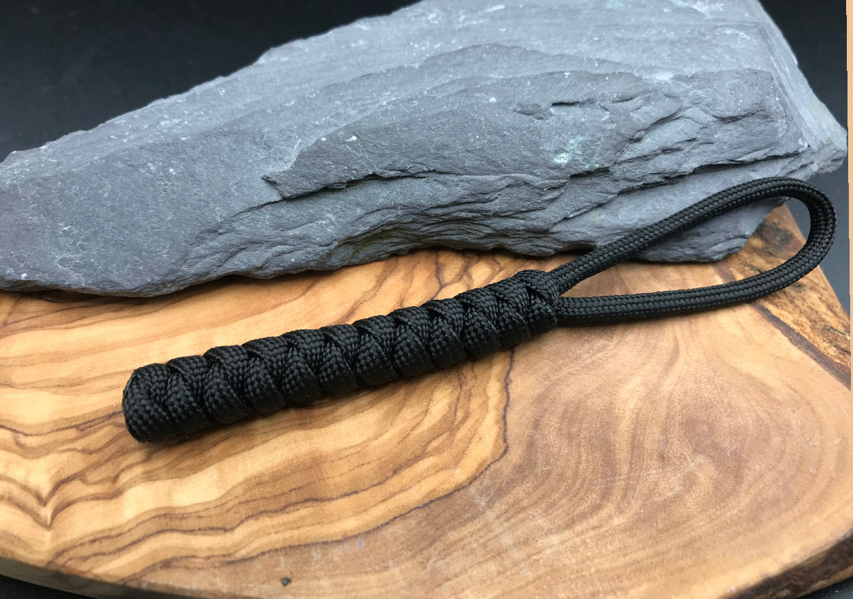 Paracord EDC multi tool - torch and keys lanyard 
Is Hand Made in Black coloured Paracord for that tactical look and woven in the snake knot design