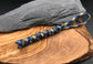 Hand made Paracord lanyard in Oasis blue camo is a blue and light brown coloured snake knot design