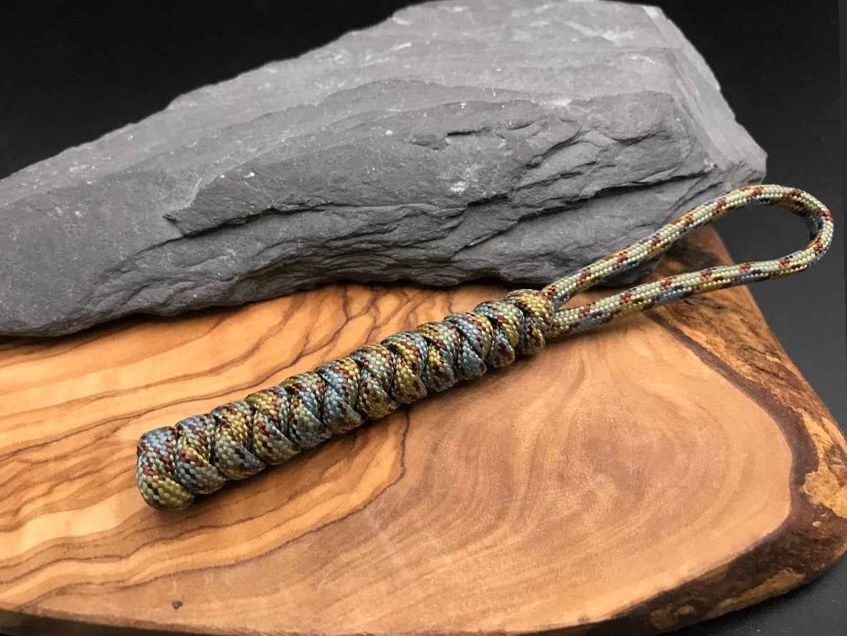 Paracord EDC multi tool - torch and keys lanyard 
Hand made Paracord lanyard in Sand snake themed colours ( light browns and sand camo woven in a snake knot design