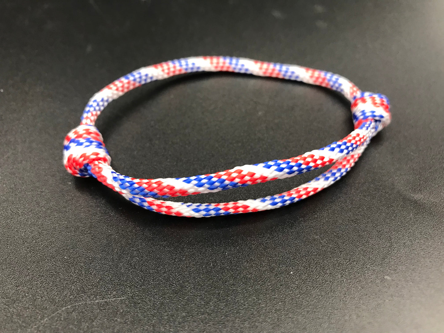 Paracord friendship bracelet In United States themed colours ( blue white and red ) light weight and adjustable