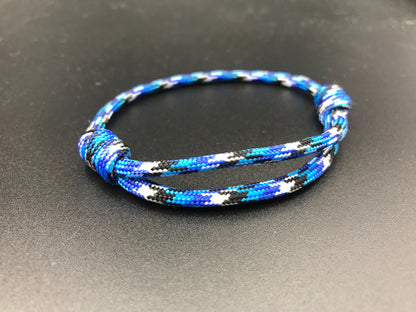 Paracord friendship bracelet in ocean camo blue white black and dark blue 