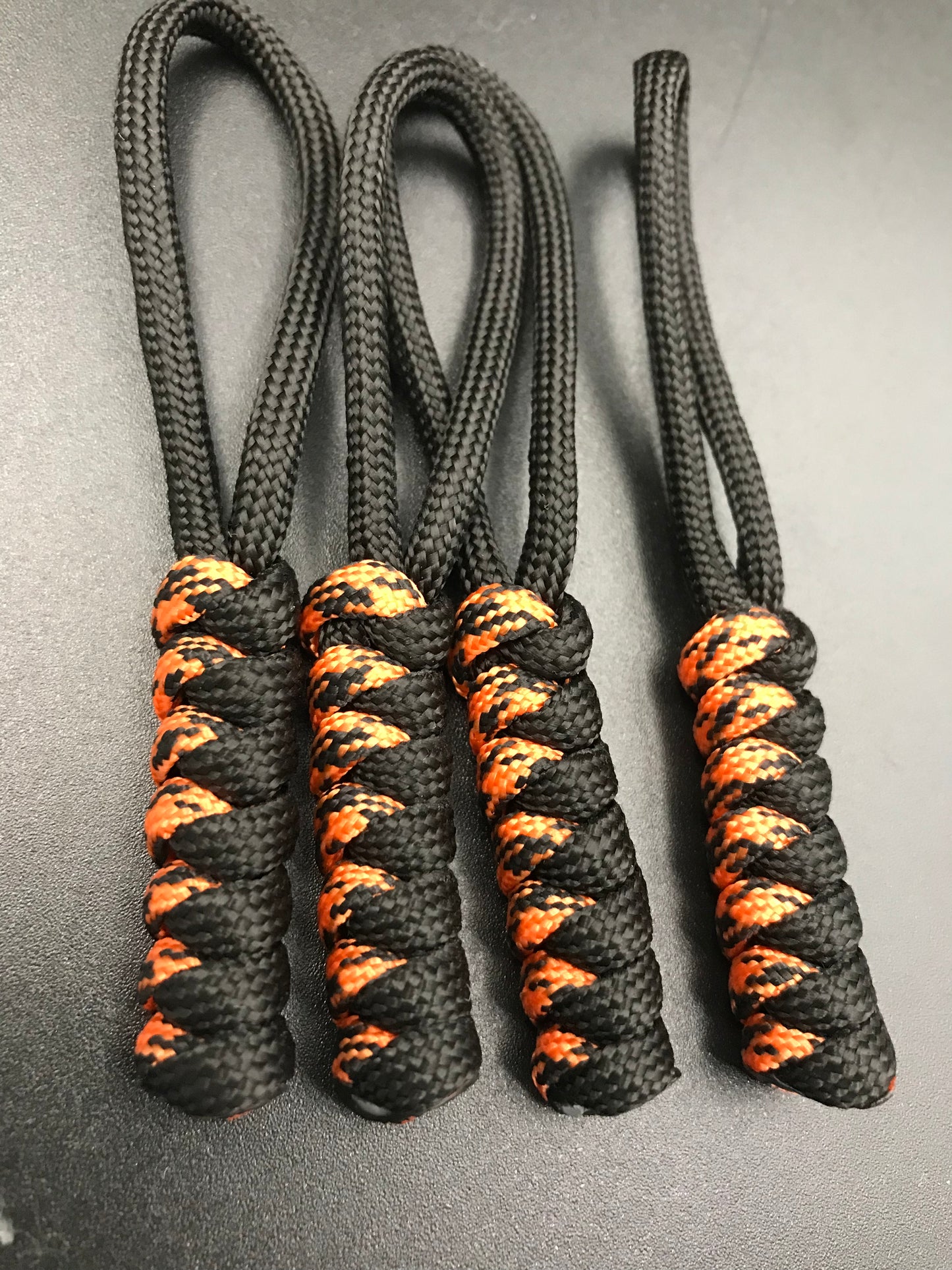 Paracord zip pulls in black & tiger orange ( black/orange mix ) (4 pack) hand made in U.K. 