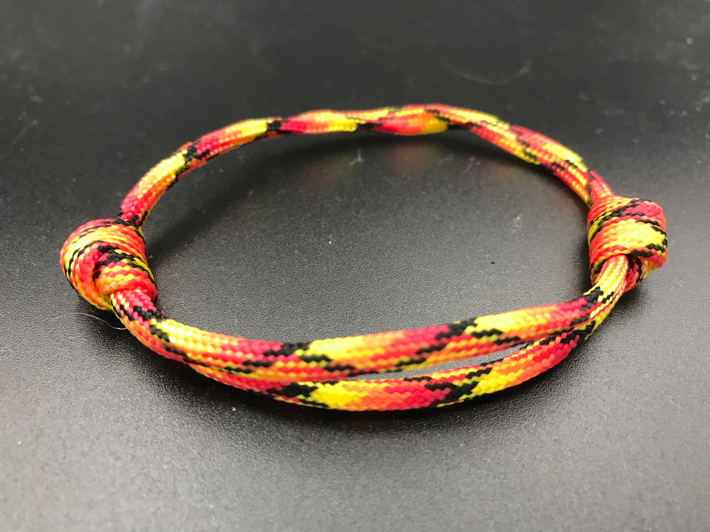 Friendship bracelet in fireball colours red yellow Orange 