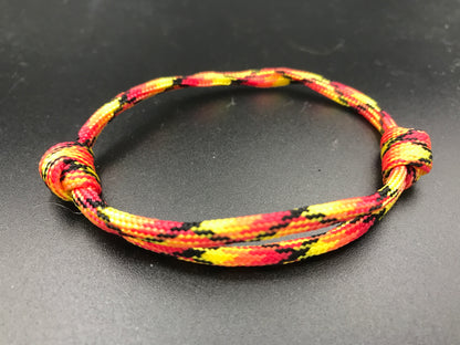 Friendship bracelet in fireball colours red yellow Orange 