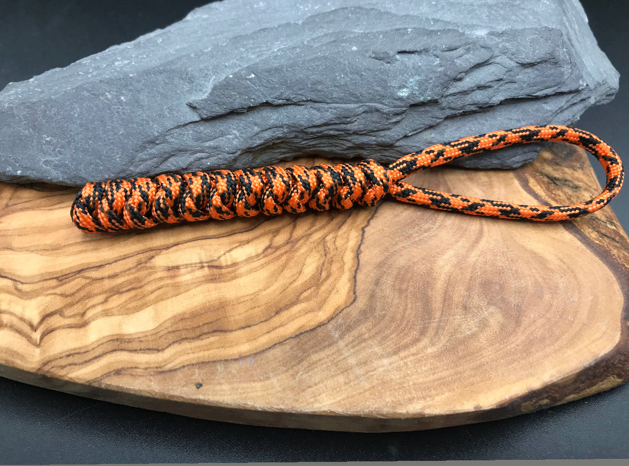Hand made Paracord EDC multi tool - torch and keys lanyard 
Made from Tiger orange (orange/ black coloured Paracord in a snake knot design