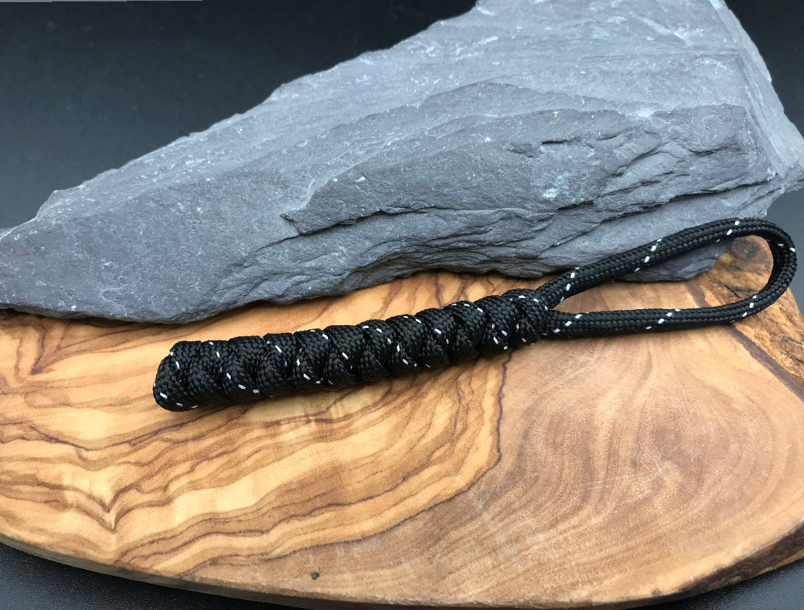 Hand made Paracord EDC multi tool - torch and keys lanyard 
Made from Tactical black (black with silver) coloured Paracord in a snake knot design