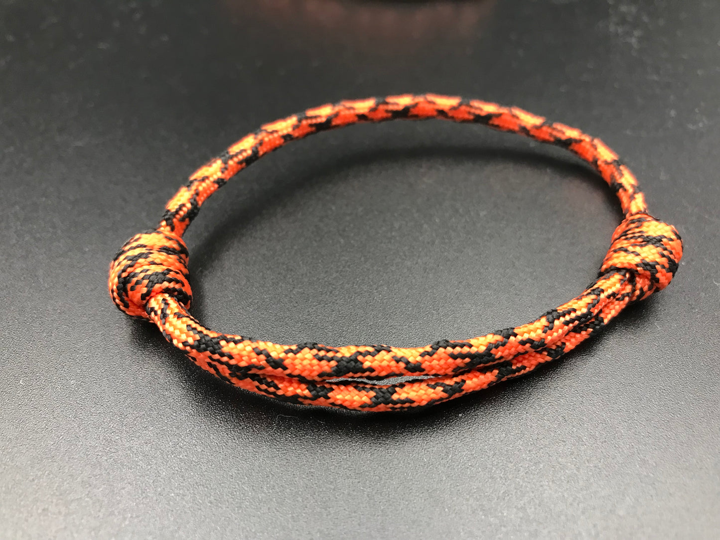 Paracord friendship bracelet In tiger Orange (orange and black ) light weight and adjustable