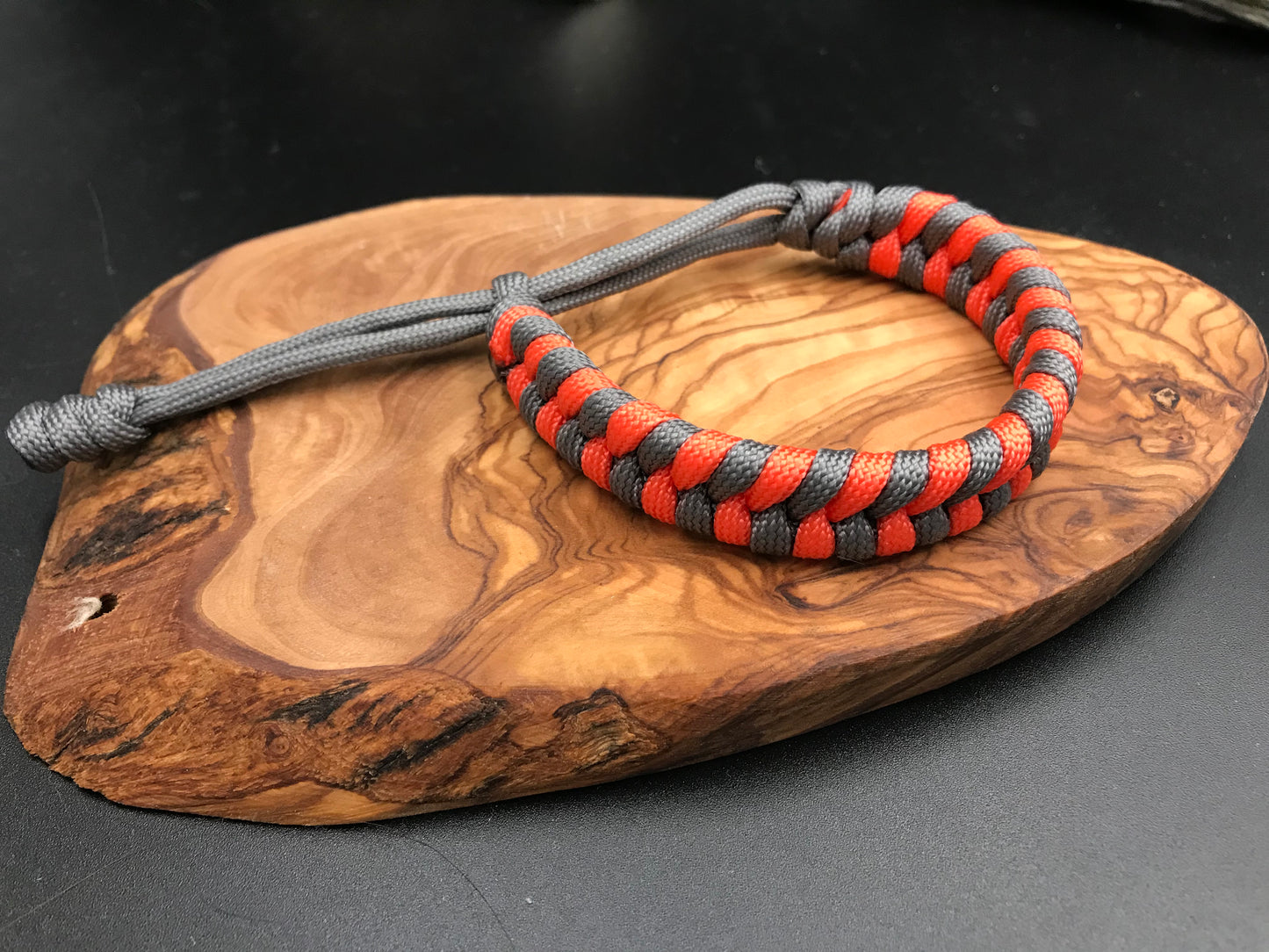 Handmade Paracord Fishtail weave bracelet in A tactical grey and orange stripe design