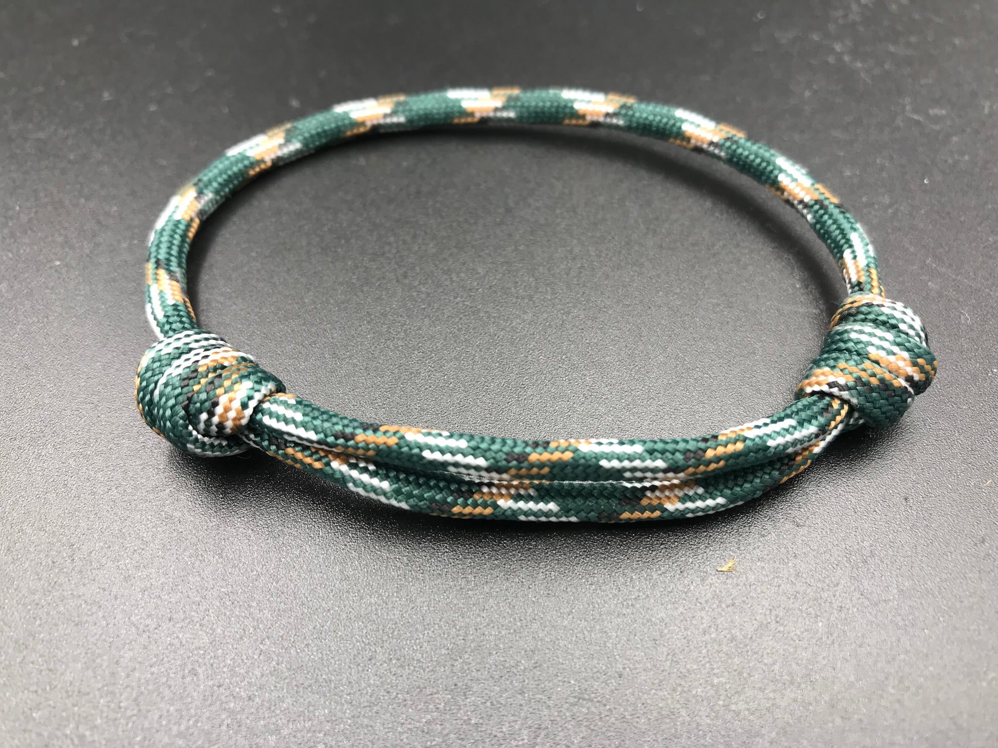 Paracord friendship bracelet In urban camo ( dark green light brown and white ) light weight and fully adjustable