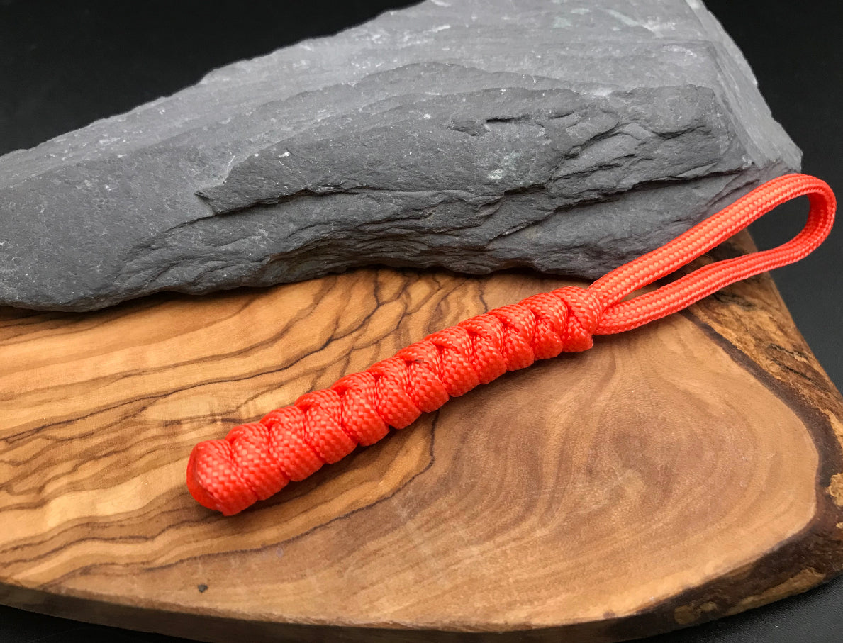 Paracord EDC multi tool - torch and keys lanyard 
Hand made Paracord tool lanyard in a bright neon orange colour and woven in the serpent snake knot design