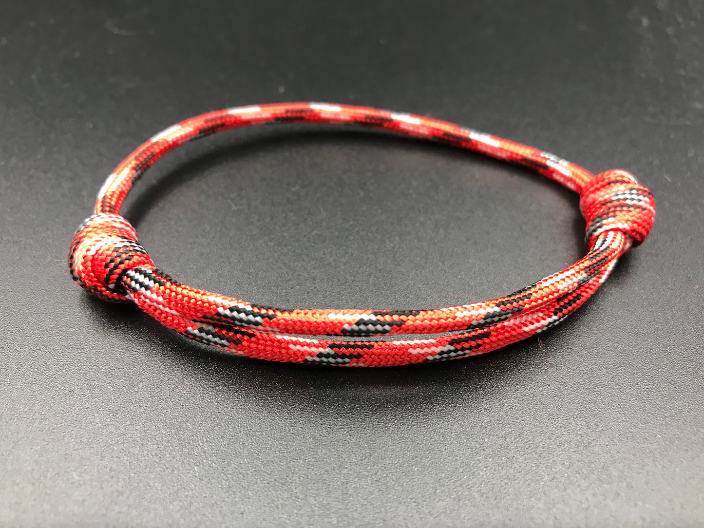 Paracord friendship bracelet In Russian Red ( red white with hint of black 