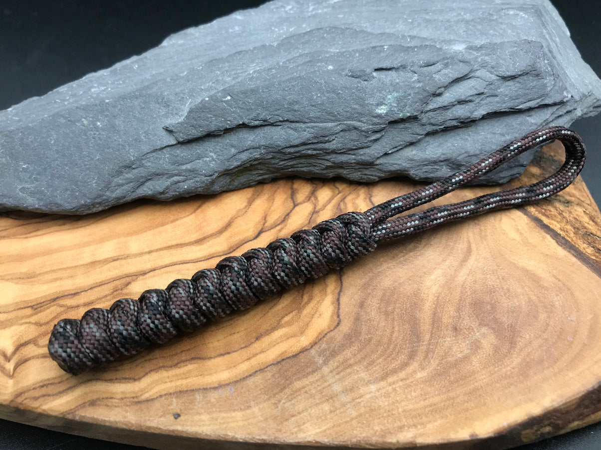 Hand made Paracord EDC multi tool - torch and keys lanyard 
Made from Burnt hickory brown coloured paracord it’s dark earthy colours woven in a snake knot design