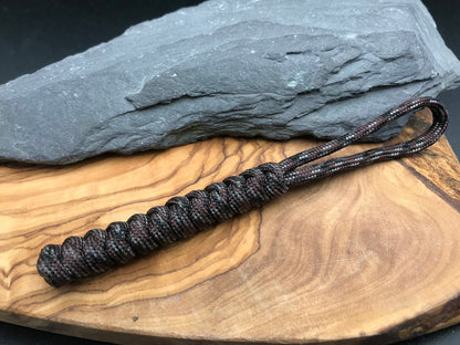 Hand made Paracord EDC multi tool - torch and keys lanyard 
Made from Burnt hickory brown coloured paracord it’s dark earthy colours woven in a snake knot design