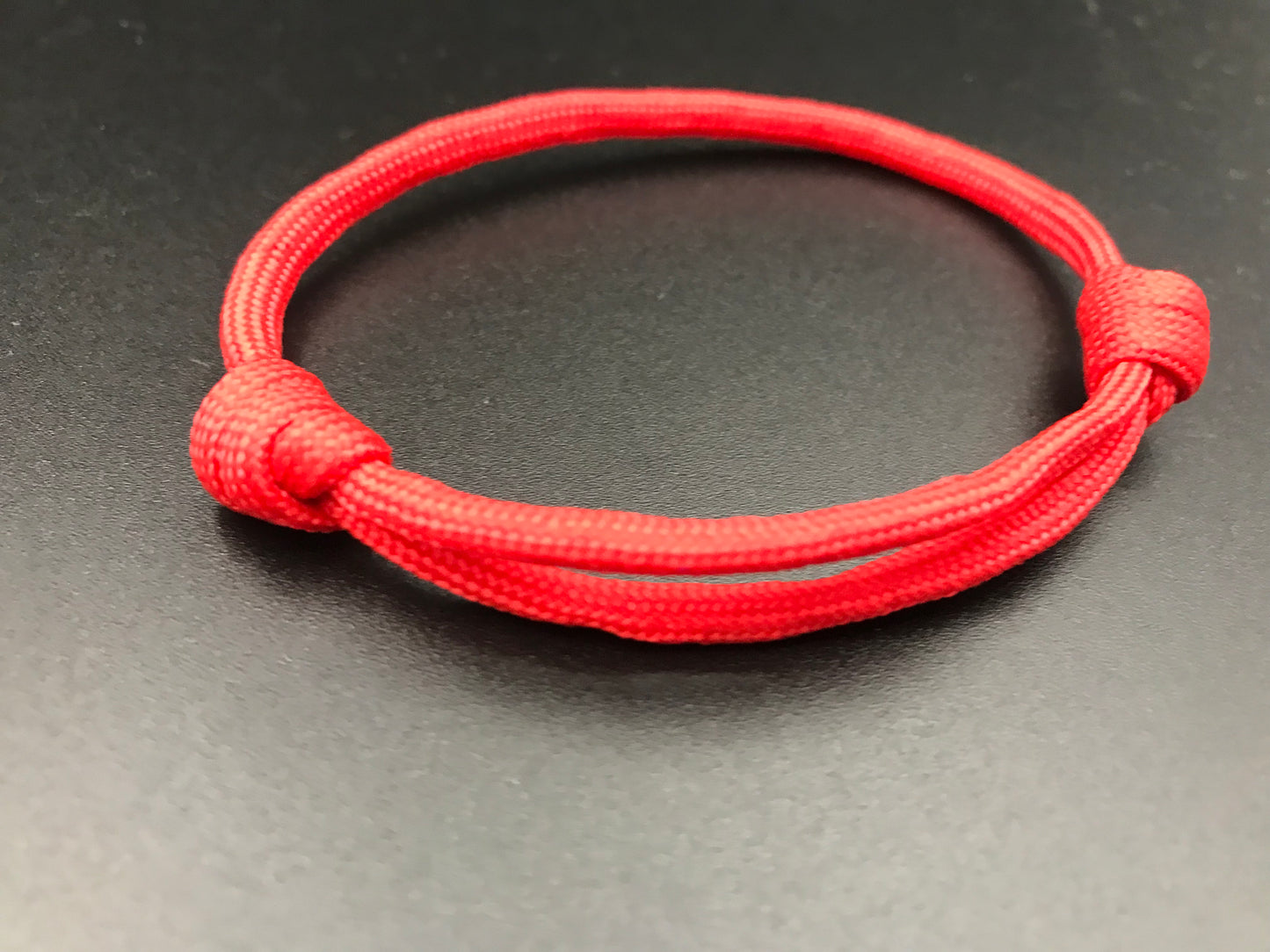 Paracord friendship bracelet In red light weight and adjustable