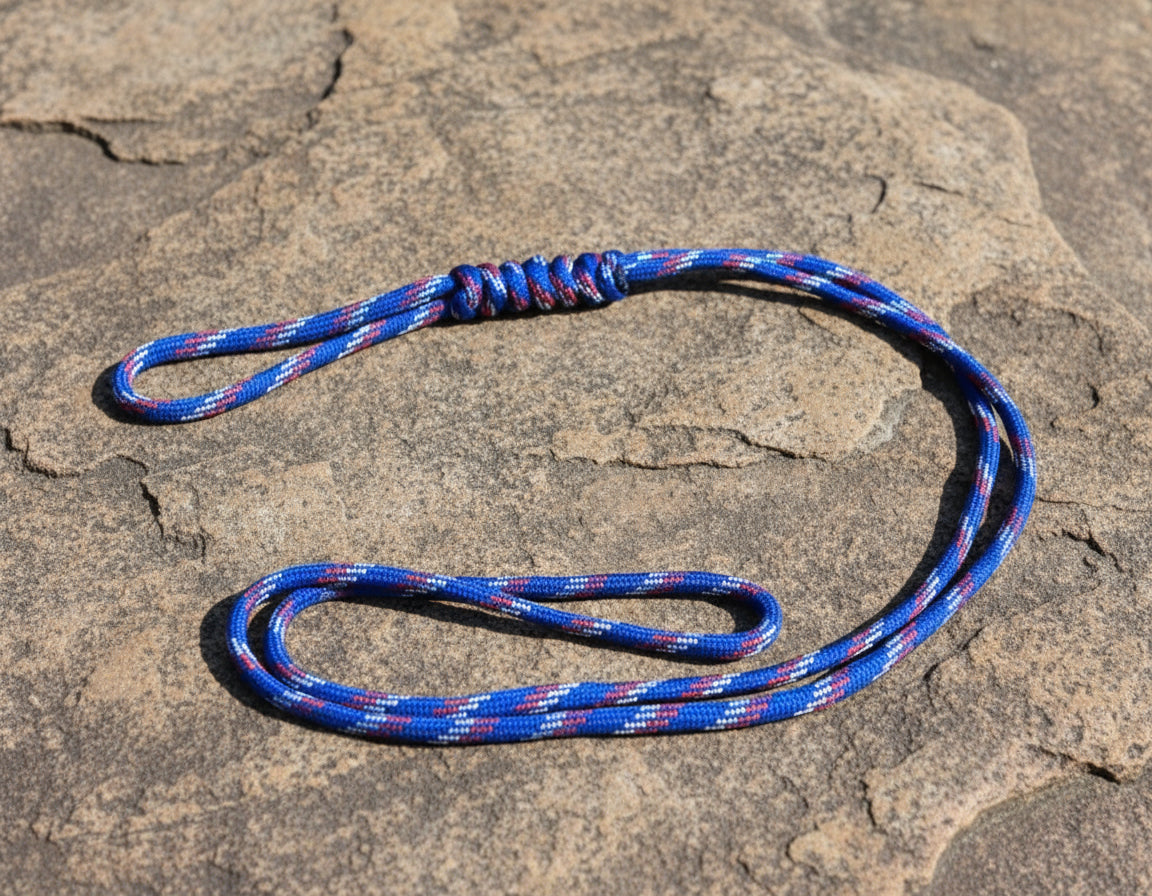 Blue and red rope on a textured stone surface